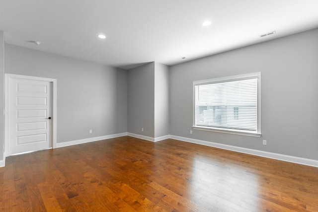 3495 Travertine Ln, Chattanooga, TN 37405 - unfurnished room featuring dark wood-style floors, baseboards, and recessed lighting