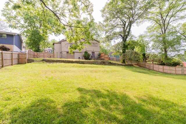 view of yard with a fenced backyard