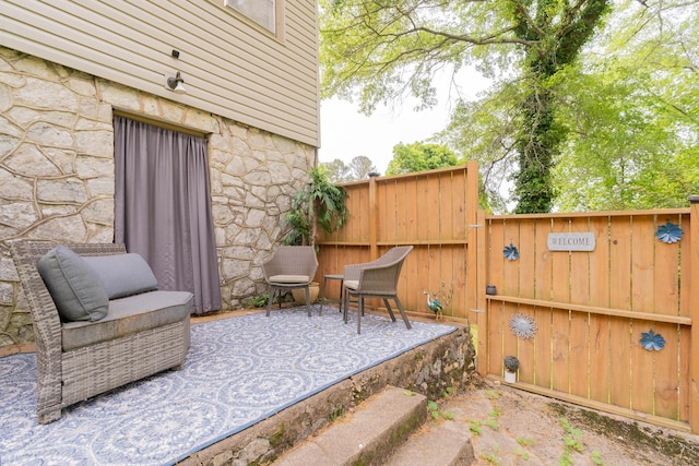 view of patio / terrace featuring fence