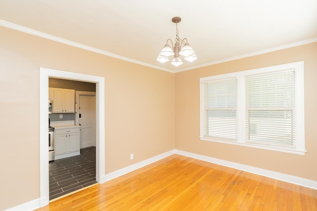empty room with light wood-style floors, baseboards, and a notable chandelier
