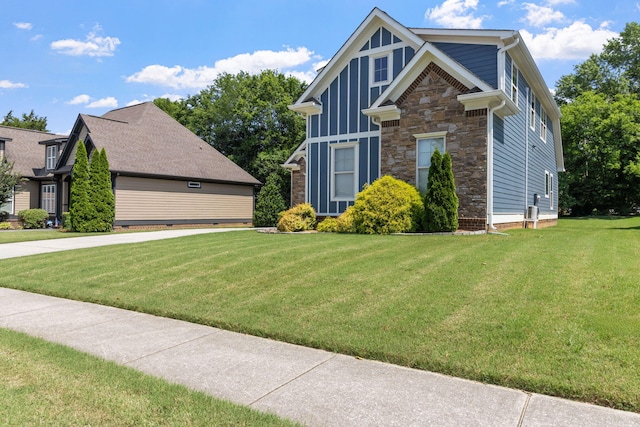 8209 Robertsview Dr, Ooltewah, TN 37363 - craftsman-style home featuring a front yard and stone siding