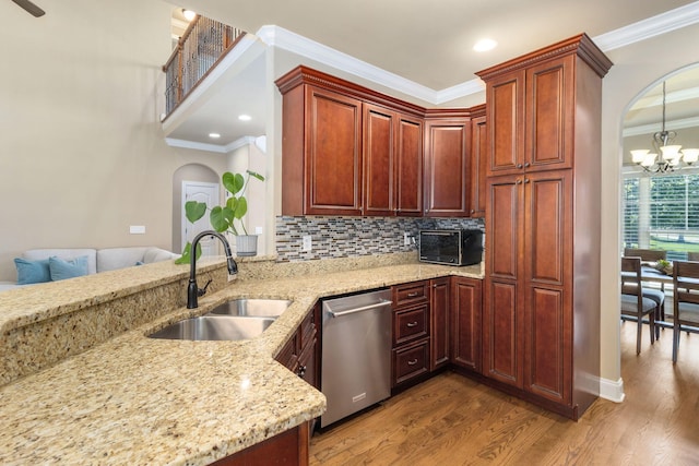 8209 Robertsview Dr, Ooltewah, TN 37363 - kitchen with stainless steel dishwasher, a sink, arched walkways, a chandelier, and crown molding