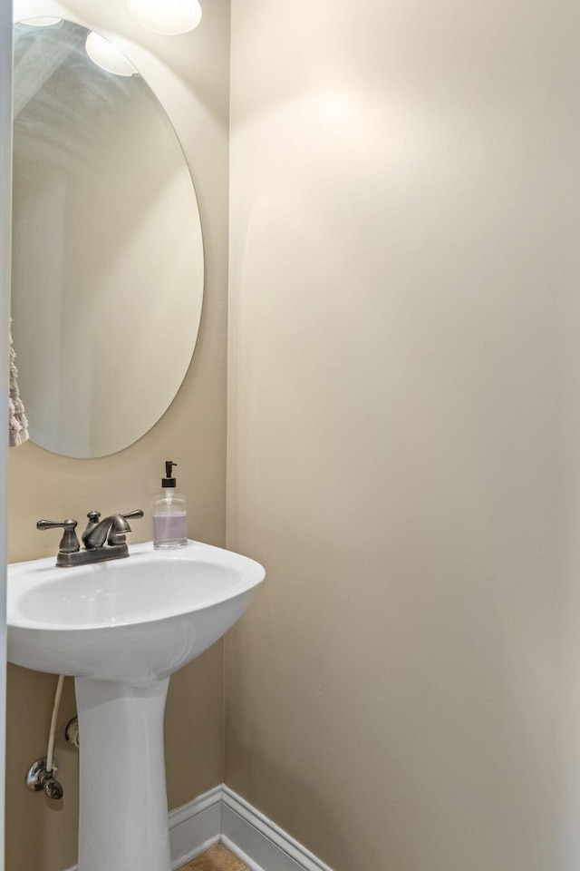 8209 Robertsview Dr, Ooltewah, TN 37363 - bathroom with baseboards and a sink