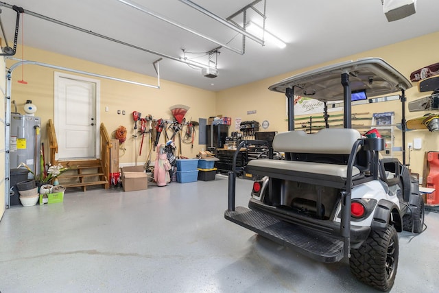 8209 Robertsview Dr, Ooltewah, TN 37363 - garage featuring water heater and a garage door opener