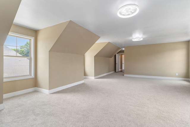 8209 Robertsview Dr, Ooltewah, TN 37363 - additional living space featuring light carpet, baseboards, and lofted ceiling