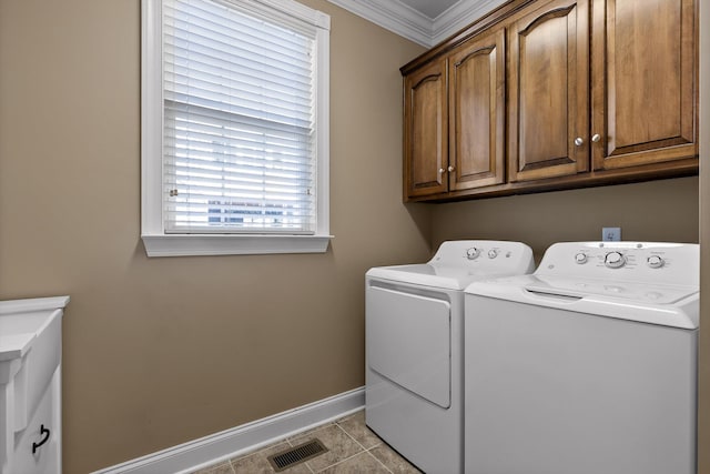 laundry room with tile patterned flooring, cabinet space, baseboards, ornamental molding, and washer and dryer