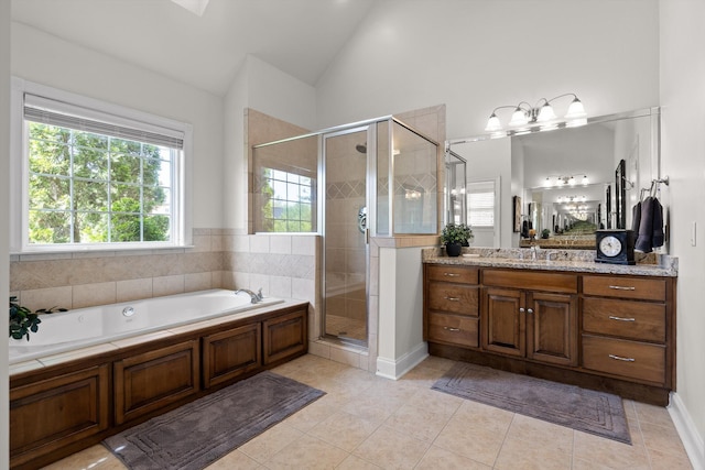 bathroom featuring a garden tub, tile patterned flooring, a shower stall, vanity, and lofted ceiling