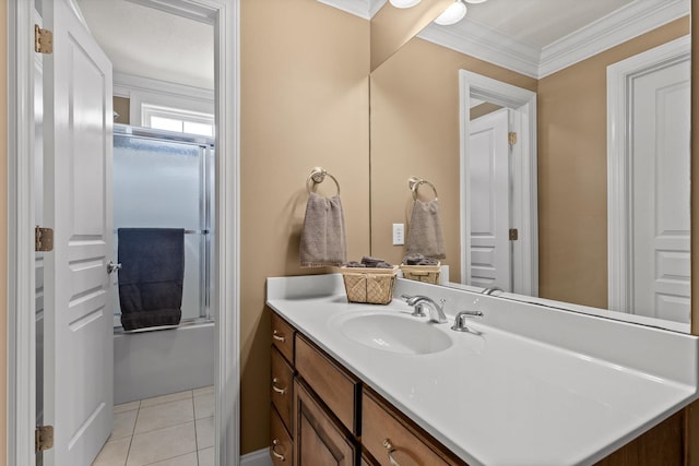 full bath with crown molding, vanity, and tile patterned floors