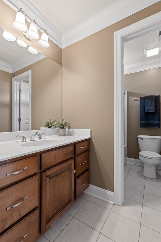 bathroom with tile patterned floors, baseboards, vanity, toilet, and ornamental molding