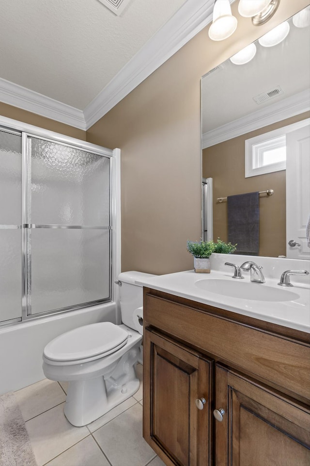 full bathroom featuring crown molding, shower / bath combination with glass door, toilet, tile patterned floors, and visible vents