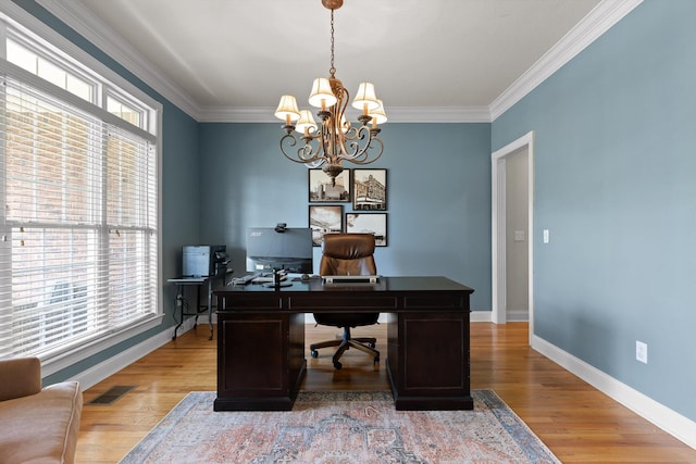 home office featuring an inviting chandelier, crown molding, light wood finished floors, and visible vents