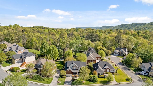 aerial view with a residential view and a wooded view