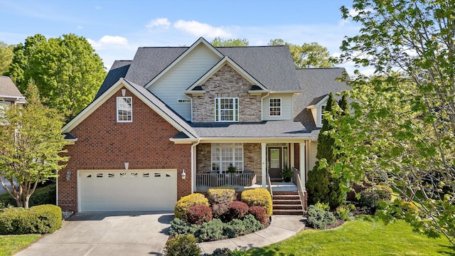 craftsman-style home featuring covered porch, stone siding, roof with shingles, concrete driveway, and an attached garage