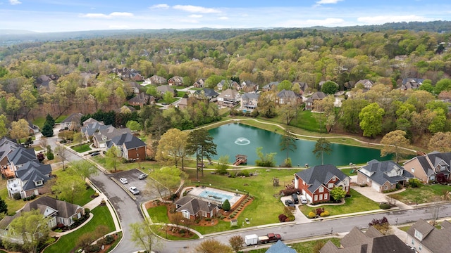 aerial view featuring a water view, a residential view, and a forest view