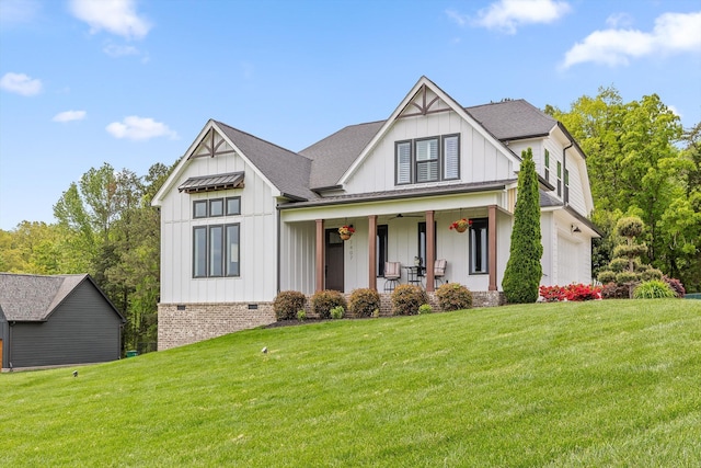 7407 Pond Vw, Harrison, TN 37341 - modern farmhouse style home with covered porch, crawl space, board and batten siding, and a front lawn