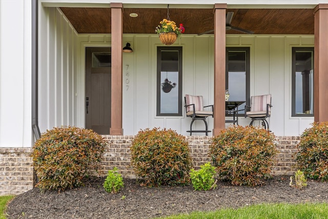 7407 Pond Vw, Harrison, TN 37341 - view of exterior entry with a porch and board and batten siding