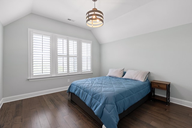 7407 Pond Vw, Harrison, TN 37341 - bedroom with vaulted ceiling, multiple windows, and wood finished floors