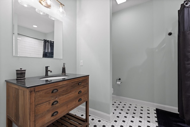 7407 Pond Vw, Harrison, TN 37341 - bathroom featuring toilet, baseboards, and vanity