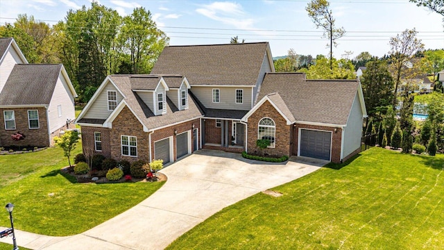 3874 Sweet Bay Ln, Apison, TN 37302 - view of front of home featuring an attached garage, a front lawn, driveway, and brick siding
