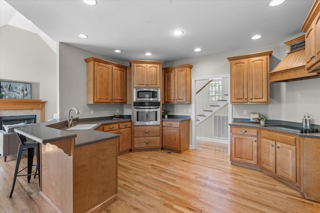 3874 Sweet Bay Ln, Apison, TN 37302 - kitchen with a peninsula, dark countertops, appliances with stainless steel finishes, and a sink