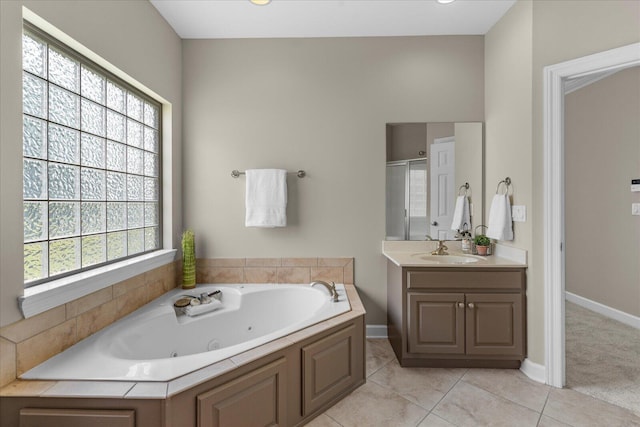 3874 Sweet Bay Ln, Apison, TN 37302 - full bathroom featuring a stall shower, vanity, a whirlpool tub, baseboards, and tile patterned flooring