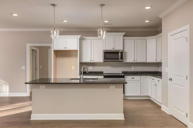 370 Winchester Dr Unit 70, Rossville, GA 30741 - kitchen featuring a kitchen island with sink, a sink, stainless steel microwave, dark wood finished floors, and white cabinetry