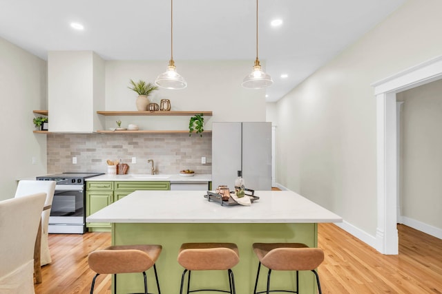 5107 Beulah Ave, Chattanooga, TN 37409 - kitchen featuring open shelves, electric stove, green cabinetry, and a breakfast bar