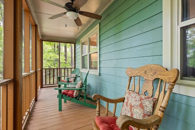 sunroom featuring ceiling fan