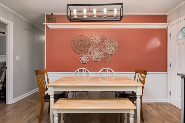 5407 Marion Ave, Chattanooga, TN 37412 - dining space featuring wood finished floors, ornamental molding, a chandelier, and a wainscoted wall
