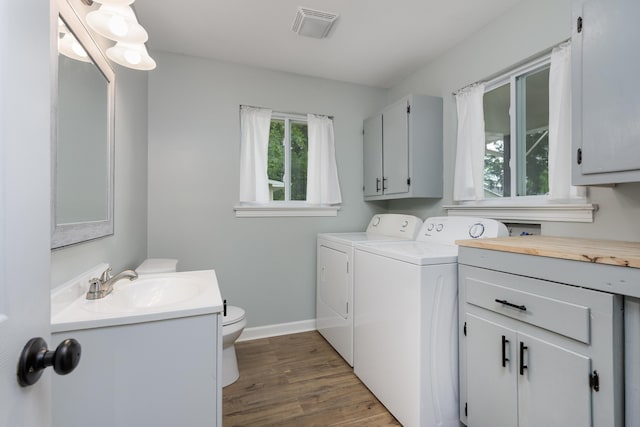 5407 Marion Ave, Chattanooga, TN 37412 - laundry room with washing machine and dryer, wood finished floors, and baseboards