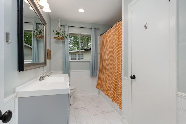 5407 Marion Ave, Chattanooga, TN 37412 - full bath with a wainscoted wall, marble look tiles, vanity, toilet, and recessed lighting
