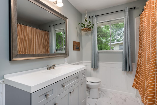 5407 Marion Ave, Chattanooga, TN 37412 - bathroom featuring wainscoting, marble finish flooring, toilet, and vanity