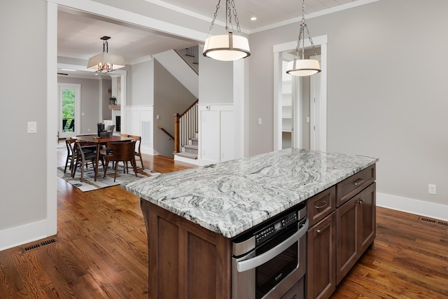 122 Parapet Trl, Chattanooga, TN 37405 - kitchen with oven, ornamental molding, dark wood-style floors, and hanging light fixtures