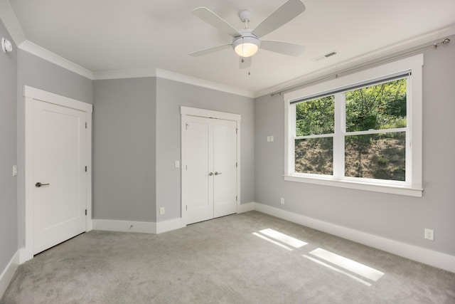 122 Parapet Trl, Chattanooga, TN 37405 - unfurnished bedroom with carpet floors, ceiling fan, baseboards, visible vents, and crown molding