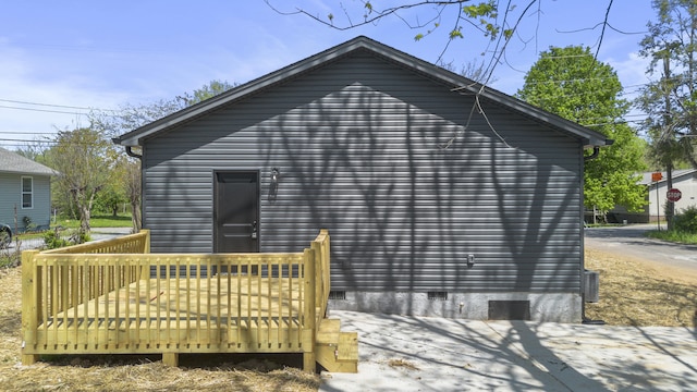 exterior space featuring a wooden deck and crawl space