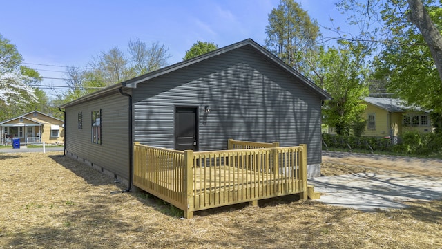 back of property with a deck