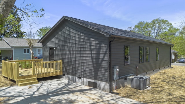 view of home's exterior with central AC, crawl space, and a deck