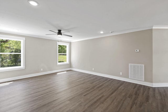 spare room featuring baseboards, a ceiling fan, crown molding, and visible vents