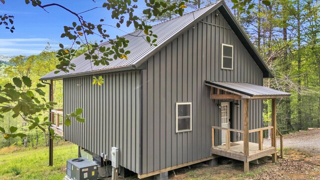 144 Hambright Rd, Reliance, TN 37369 - view of property exterior with cooling unit, metal roof, and board and batten siding