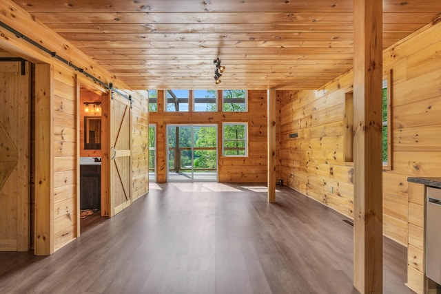 144 Hambright Rd, Reliance, TN 37369 - interior space with wooden walls, wood finished floors, a barn door, and wood ceiling