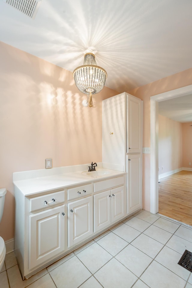 330 Battlefield Cir, Ringgold, GA 30736 - bathroom featuring toilet, a chandelier, tile patterned floors, and vanity