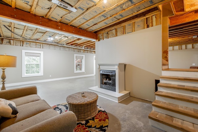 330 Battlefield Cir, Ringgold, GA 30736 - living area featuring concrete flooring, a fireplace with raised hearth, and stairs