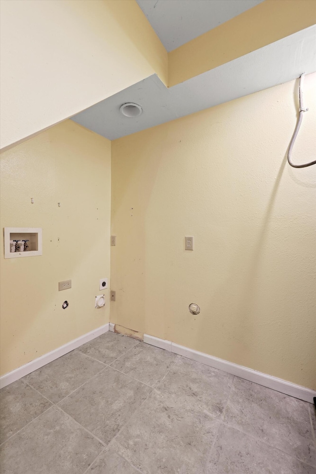 clothes washing area featuring hookup for an electric dryer, gas dryer hookup, baseboards, hookup for a washing machine, and laundry area