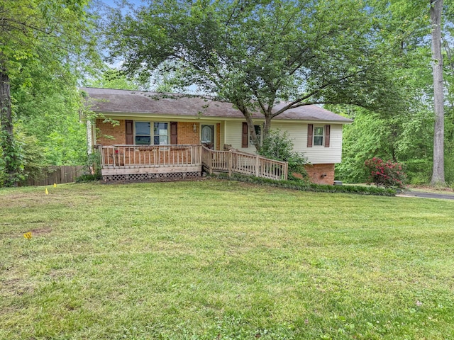ranch-style house with fence, a porch, a front lawn, and brick siding