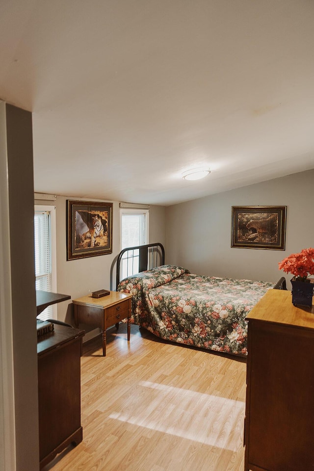 bedroom with light wood-style floors