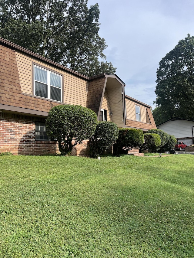 2288 Edgmon Forest Ln, Chattanooga, TN 37421 - view of front of house with a front yard and brick siding