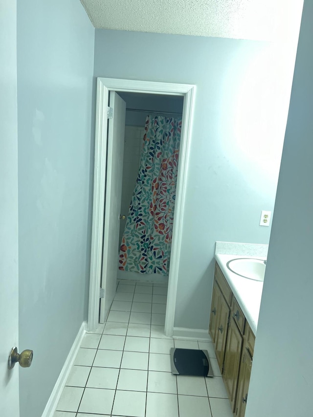 2288 Edgmon Forest Ln, Chattanooga, TN 37421 - full bath with vanity, tile patterned floors, and a textured ceiling