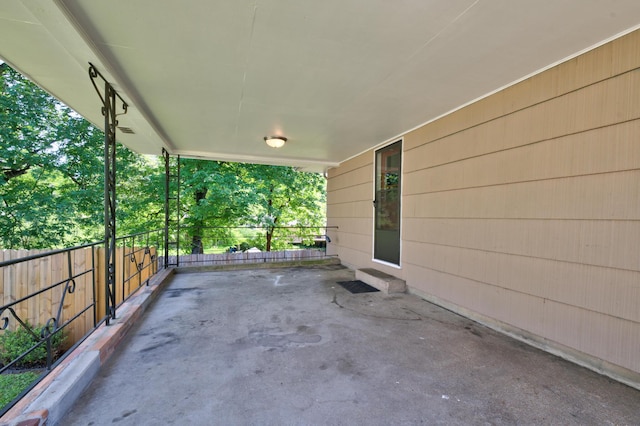 view of patio featuring fence