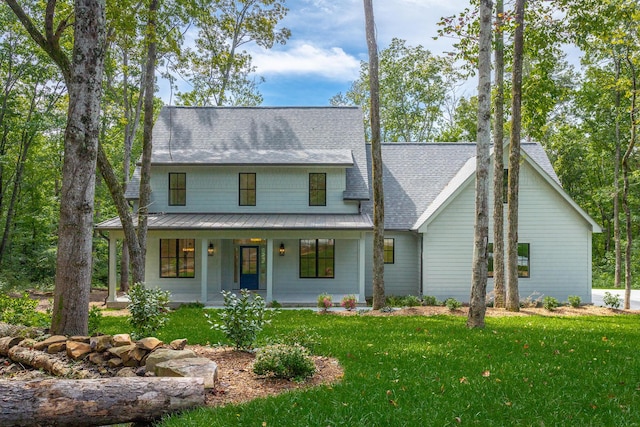 460 Spring Dr, Signal Mountain, TN 37377 - modern farmhouse featuring roof with shingles, a porch, a front lawn, and metal roof
