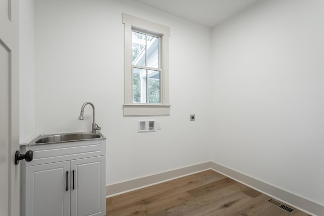 460 Spring Dr, Signal Mountain, TN 37377 - clothes washing area with light wood finished floors, a sink, hookup for an electric dryer, baseboards, and cabinet space
